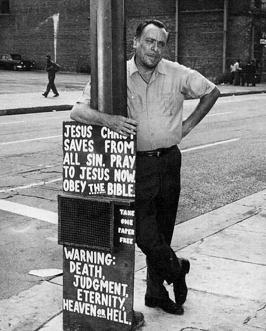 Bukowski next to repent sign